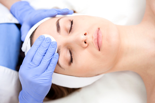 a woman lying down with her eyes closed - services